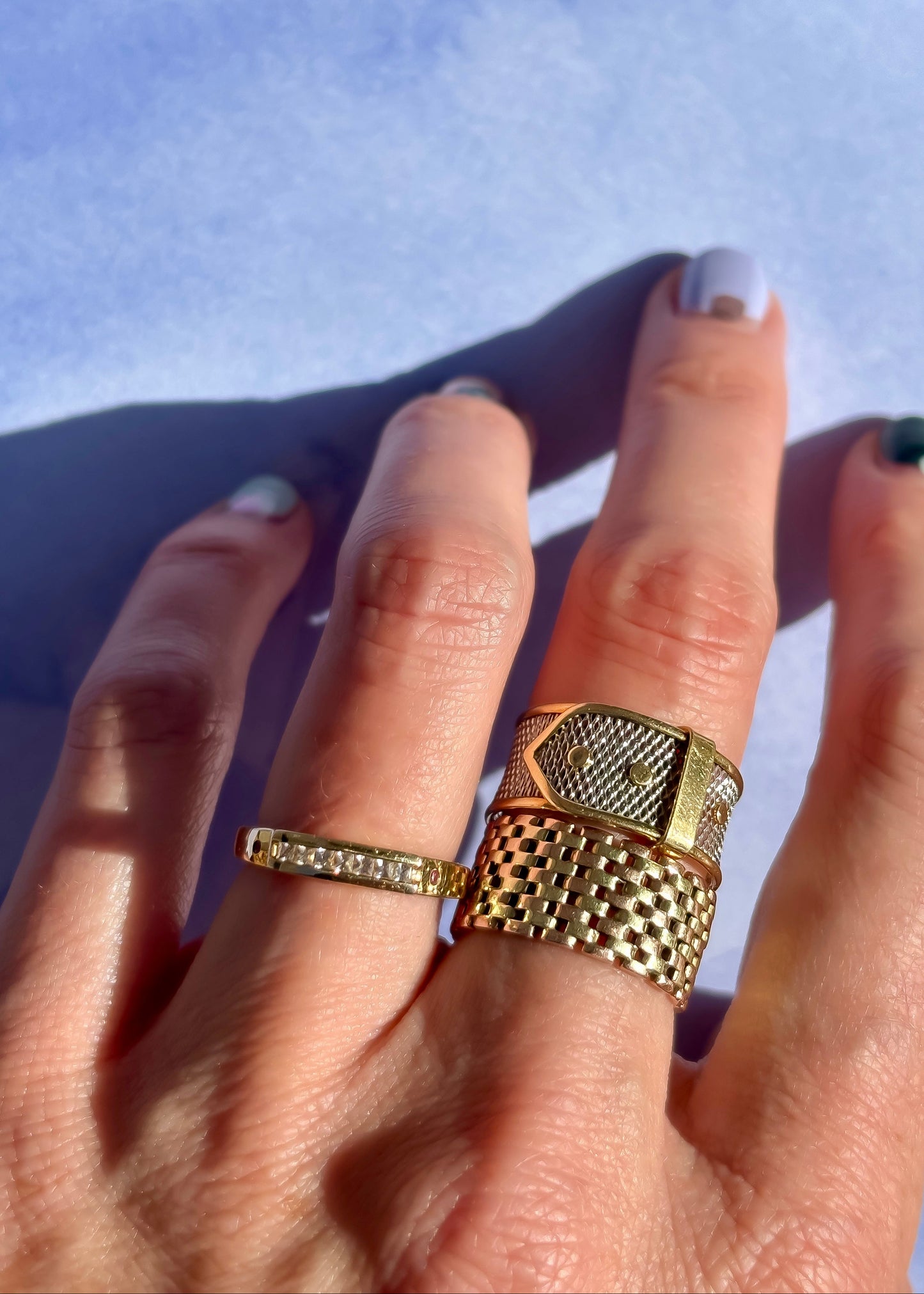 platinum buckle ring with two tone yellow gold checkerboard band