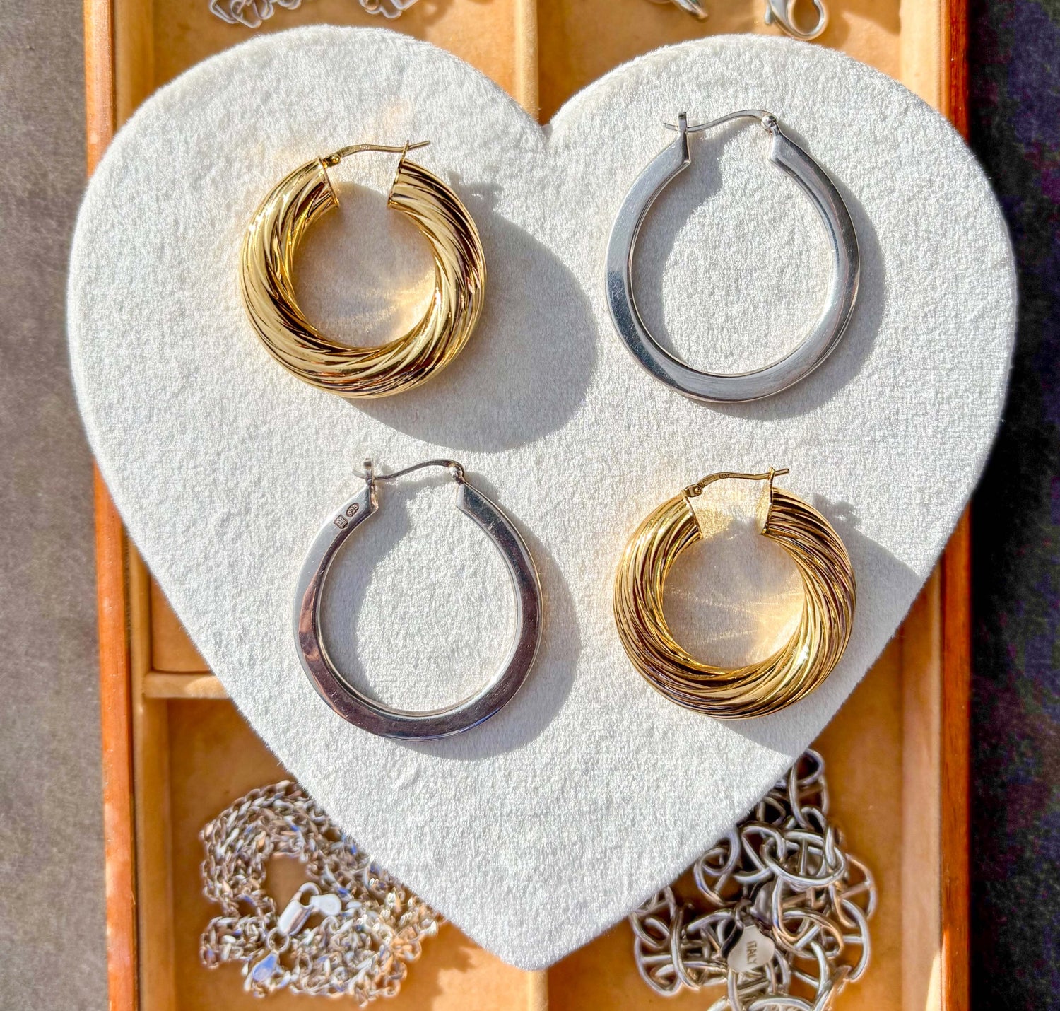 2 pairs of hoops on a velvet background