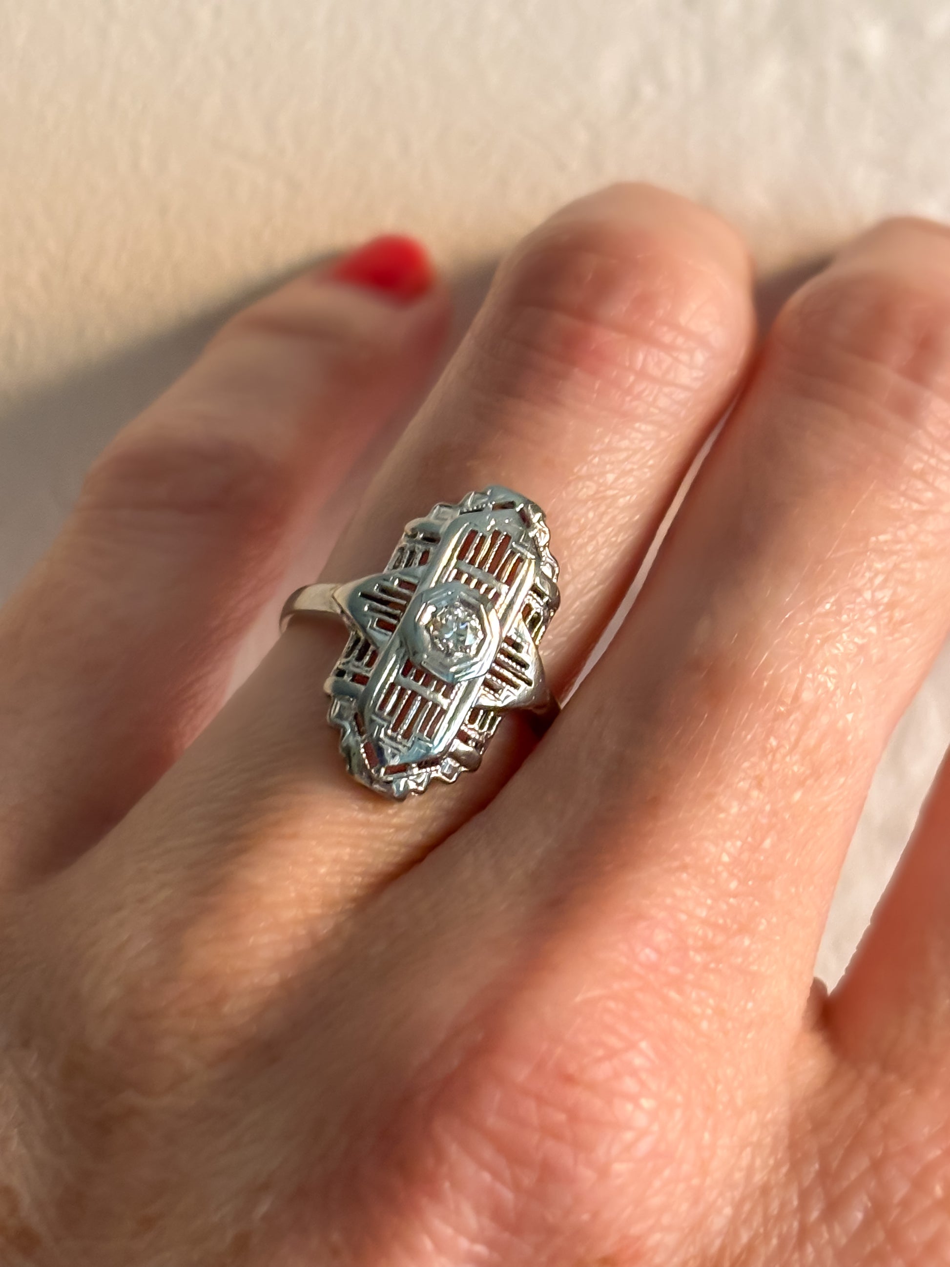 Filigree ring on wedding finger