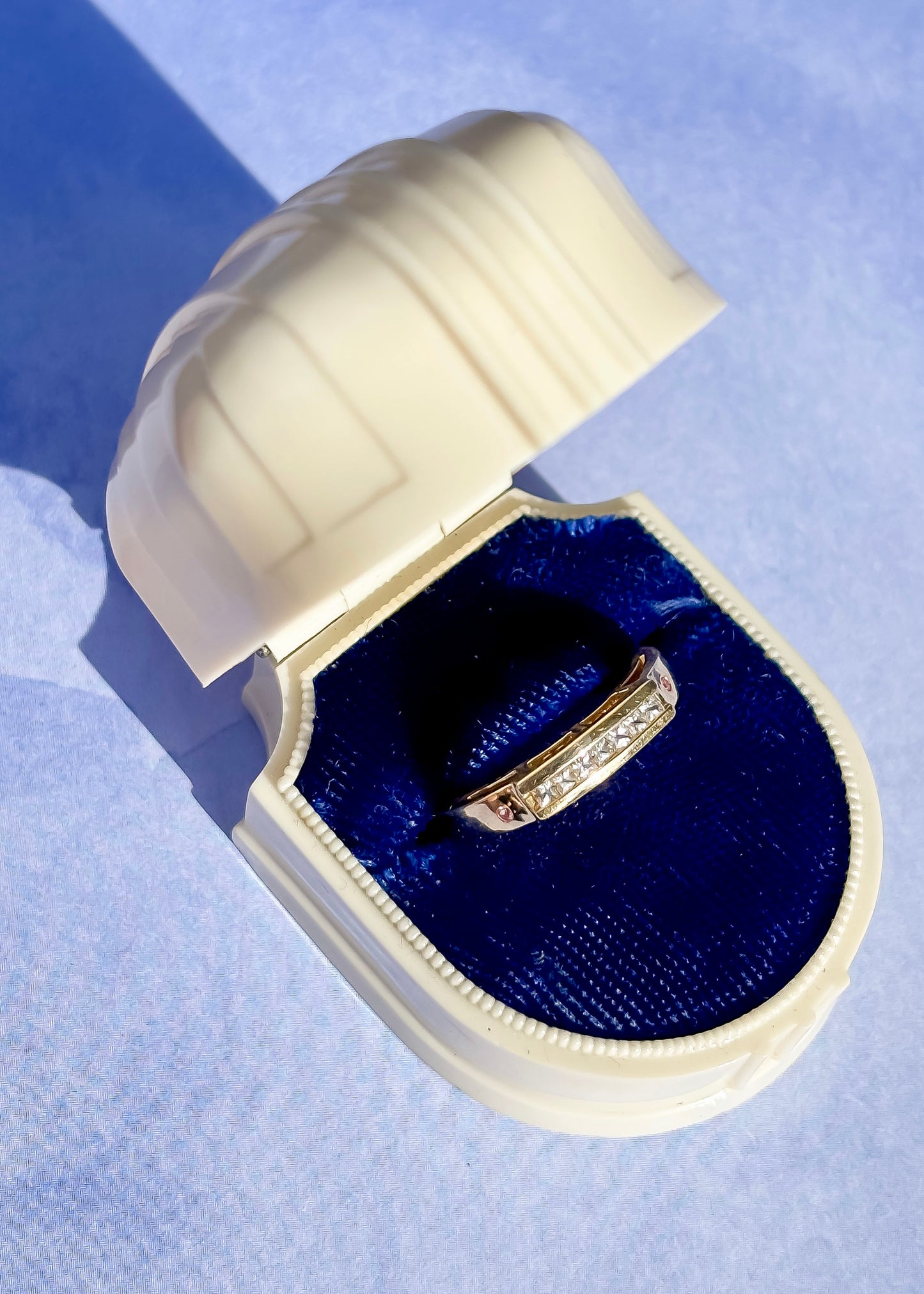 Gold and diamond band in yellow gold
with tiny pink tourmaline detail