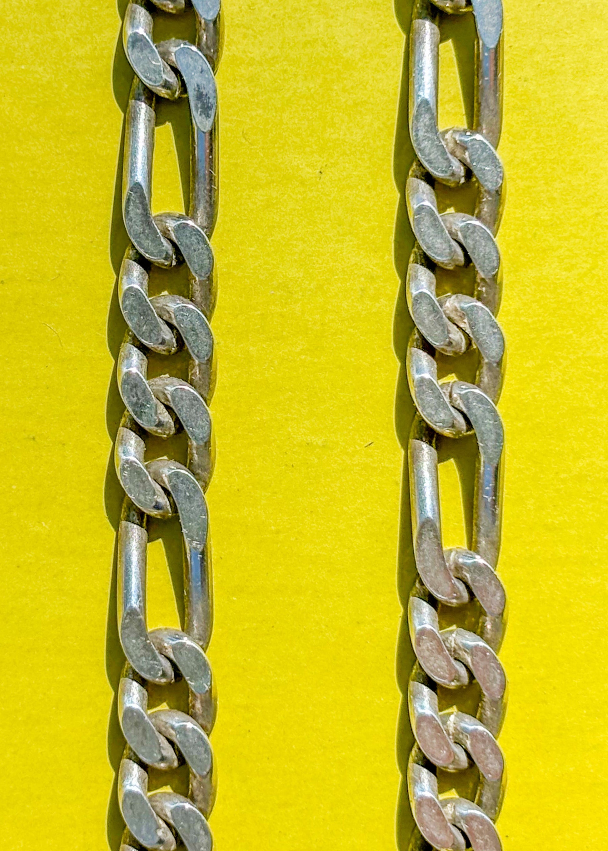 detail of vintage sterling Figaro chain