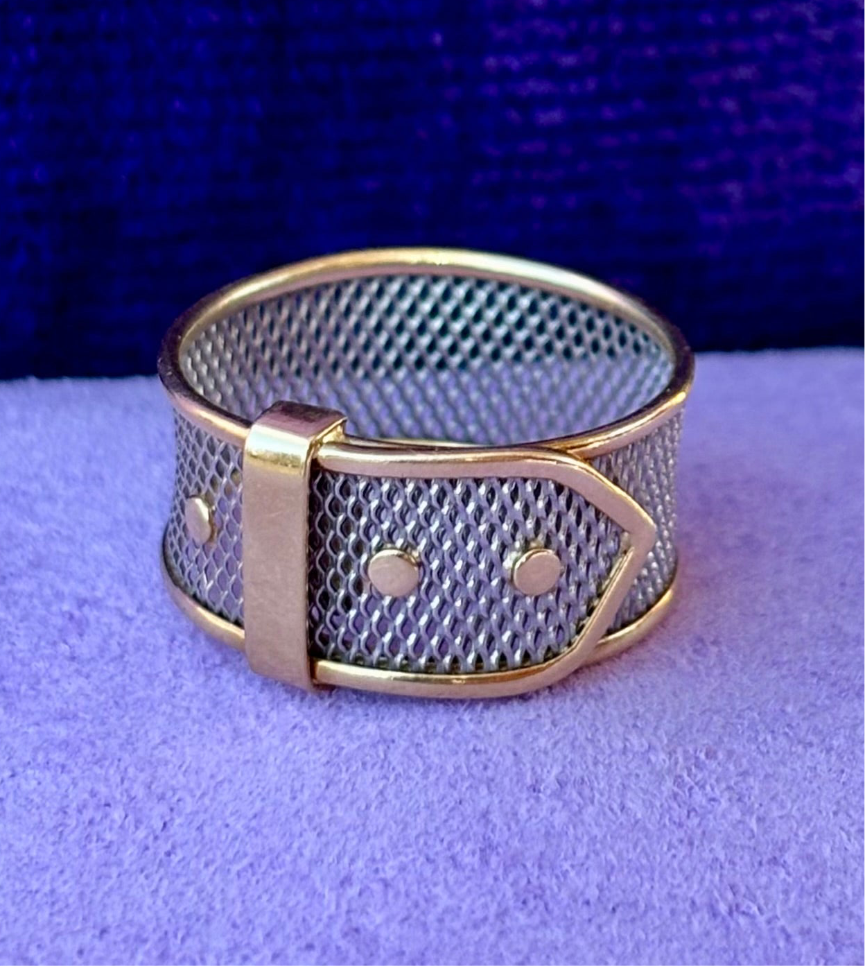 Vintage platinum ring with 18K yellow gold details and a buckle motif