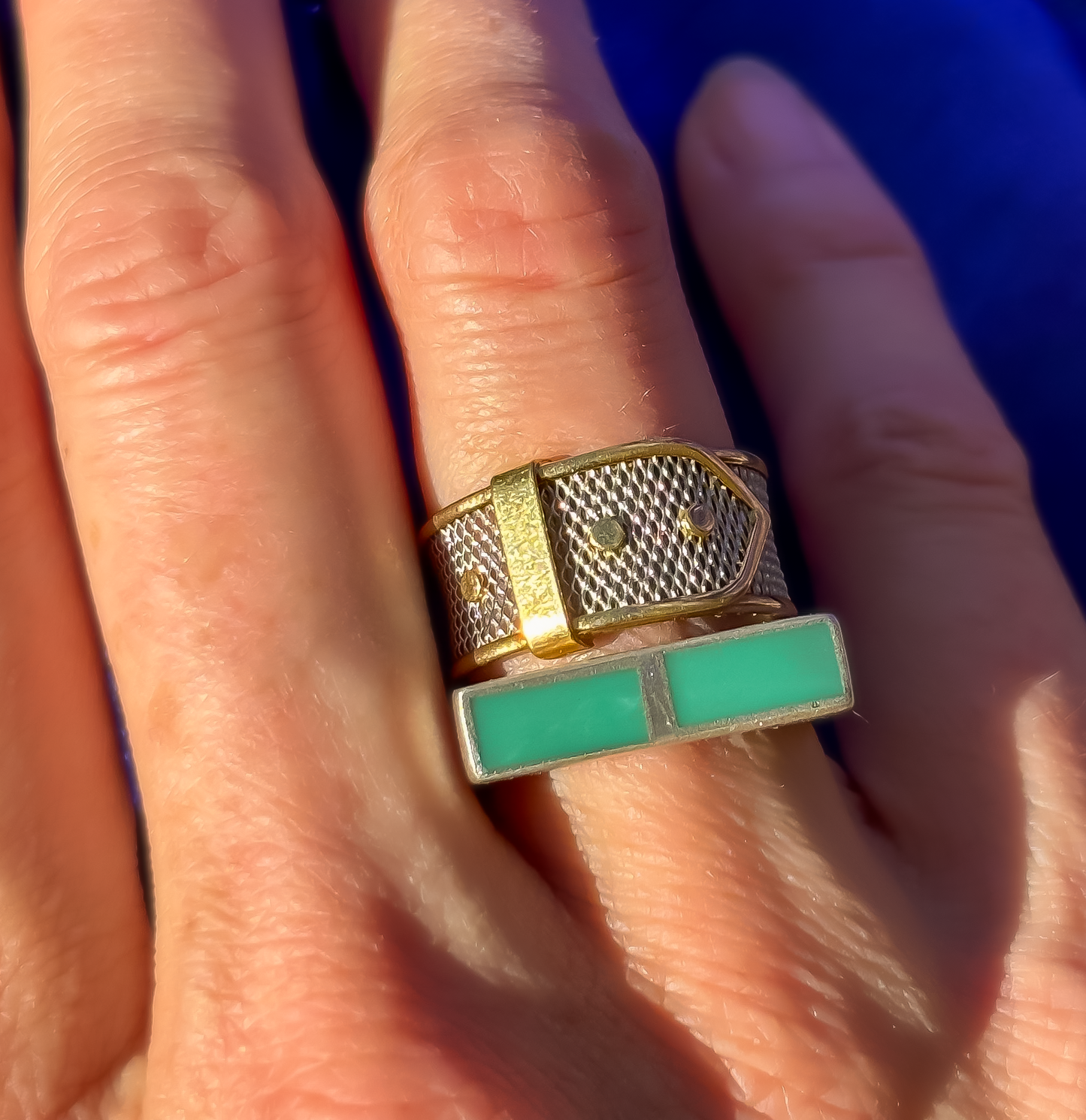 Vintage platinum and 18K gold buckle ring stacked with turquoise ring